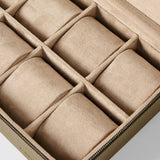 The TAWBURY Fraser 8 Watch Case in taupe features a beige suede-lined interior, eight compartments, and a zippered closure, shown here in an overhead view.