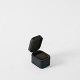 The TAWBURY Fraser 1 Watch Case in Midnight Black—a compact, square case with a hinged lid and dark interior—is displayed on a white background, ideal for protecting your favorite watch while traveling.