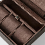The TAWBURY Fraser 3 Watch Case with Storage in brown features a suede-lined interior, multiple compartments, and a snap-button closure, shown here in close-up.