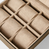 The TAWBURY Fraser 6 Watch Case in taupe offers six cushioned compartments and a zippered suede design—perfect for stylish watch or jewelry storage as an elegant alternative to a leather watch box.