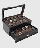 A TAWBURY Bayswater 24 Slot Watch Box with Drawer - Black filled with timepieces for watch enthusiasts.