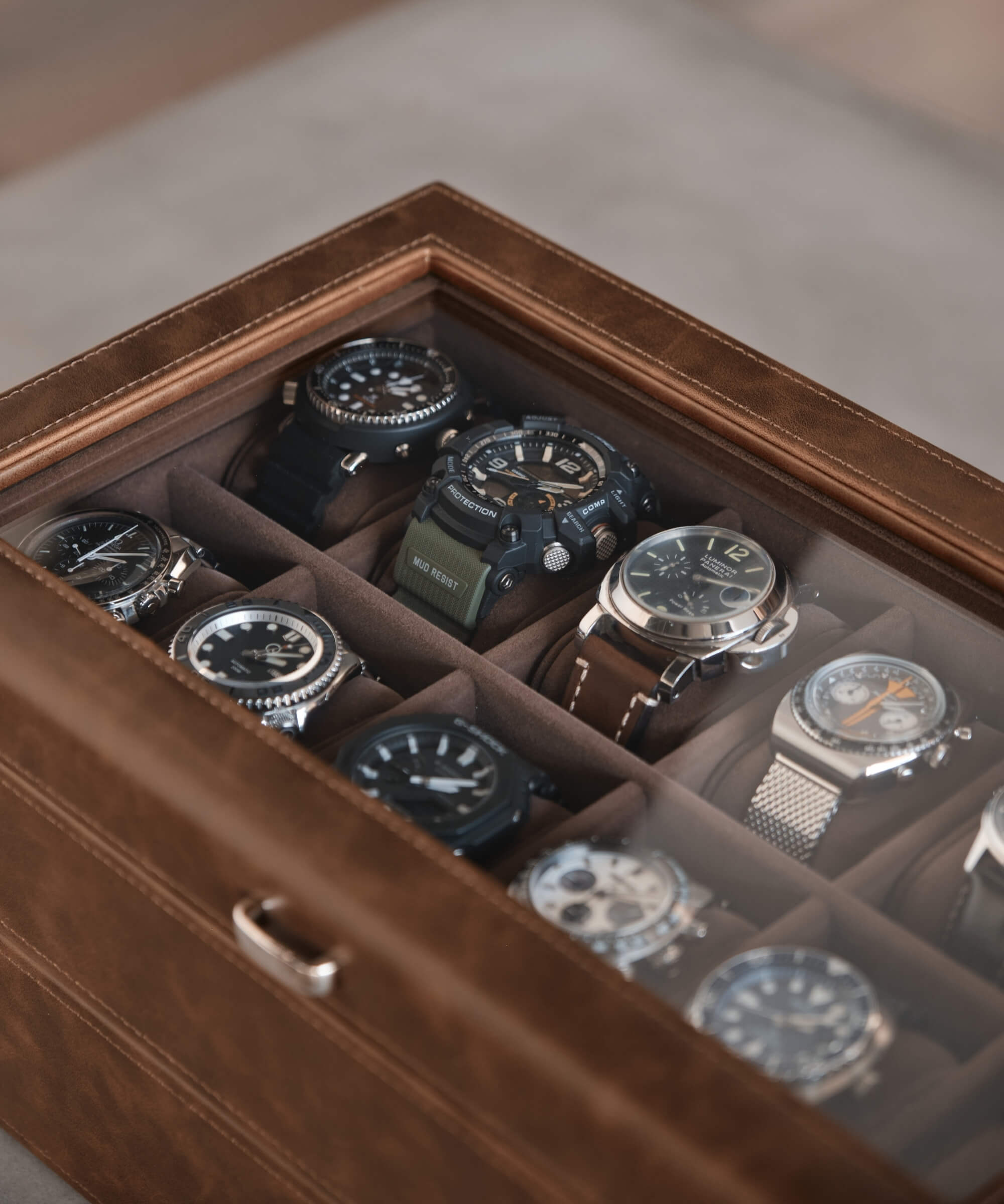 The TAWBURY Bayswater 24 Slot Watch Box with Drawer - Brown is the perfect solution to organize and protect your collection of several watches.