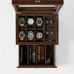 The TAWBURY Bayswater 6 Watch Jewelry Box in brown features compartments for six watches, cuffs, straps, a key, sunglasses, and a watch tool—offering elegant and organized watch storage.