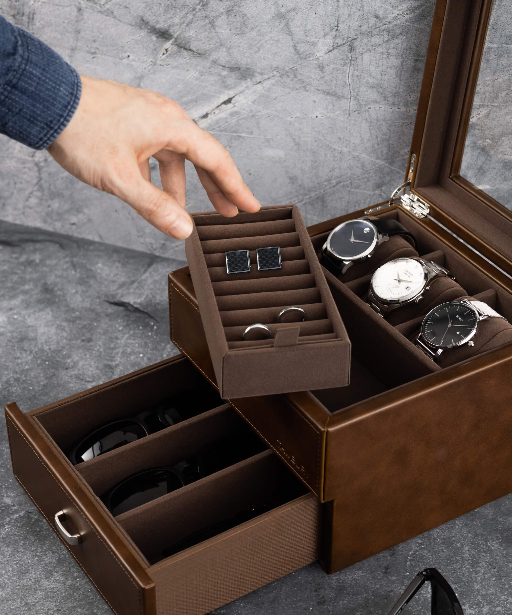 A person is opening a TAWBURY Bayswater 3 Watch Jewellery Box - Brown.