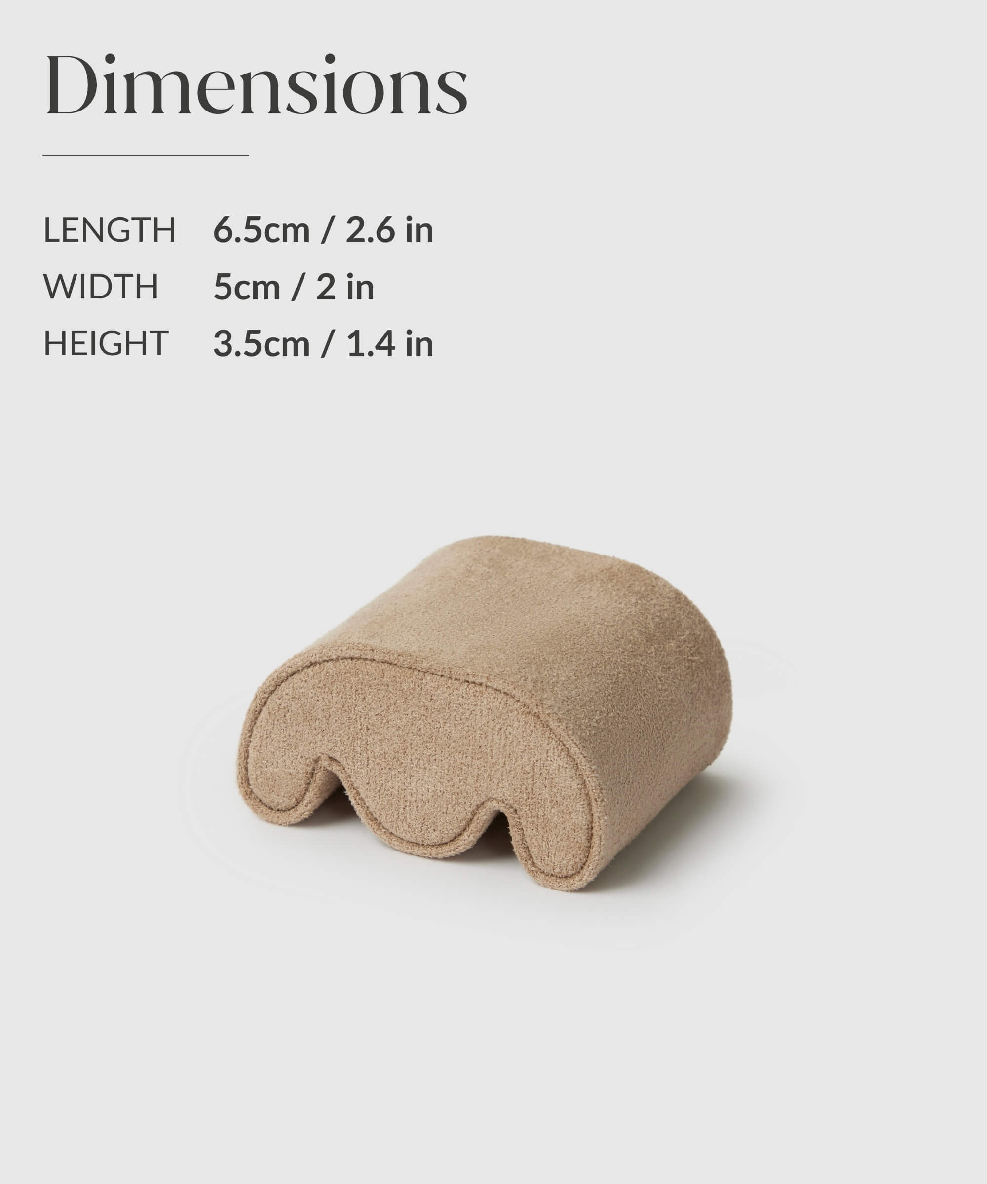 A small, beige, arch-shaped object with listed dimensions: 6.5 cm length, 5 cm width, and 3.5 cm height, perfect for slender wrist pillows ranging from wrist size 14-16.5cm.

Replace with:
The TAWBURY Grove Replacement Watch Box Pillows - X-Small - Cream is a small, beige, arch-shaped object with listed dimensions: 6.5 cm length, 5 cm width, and 3.5 cm height; perfect for slender wrist pillows ranging from wrist size 14-16.5cm.