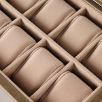 A close-up of the TAWBURY Bayswater 12 Slot Watch Box with Storage in taupe, featuring twelve padded compartments for elegant watch organization.