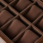 Close-up of the TAWBURY Bayswater 12 Slot Watch Box with Storage in brown, featuring a velvet-lined interior and individual padded compartments for elegant watch storage.
