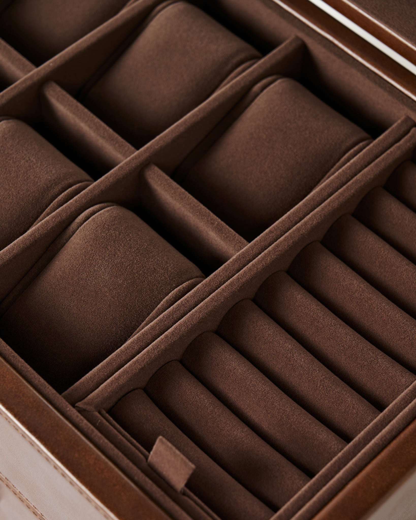 Close-up of the TAWBURY Bayswater 6 Watch Jewelry Box in brown velvet, featuring compartments for storing watches and rings.