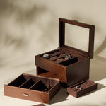 The TAWBURY Bayswater 6 Watch Jewelry Box in brown is shown open on a neutral background. This elegant case features compartments and removable trays, holding up to six watches and several cufflinks inside.