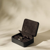 The TAWBURY Fraser 3 Watch Case with Storage in black is open, displaying elegant space for three wristwatches against a neutral background.