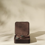 The TAWBURY Fraser 6 Watch Case - Brown offers elegant storage and style for your favorite timepieces, securely displaying up to six watches in a luxurious leather case with a refined, neutral look.