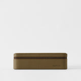 The TAWBURY Fraser 8 Watch Case in Truffle Taupe features a rectangular textured leather design with a zipper, shown against a plain white background.