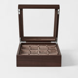 The TAWBURY Grove 12 Slot Wooden Watch Box in dark walnut with a glass lid offers elegant storage and display for your watches or jewelry, keeping them organized and protected in style.