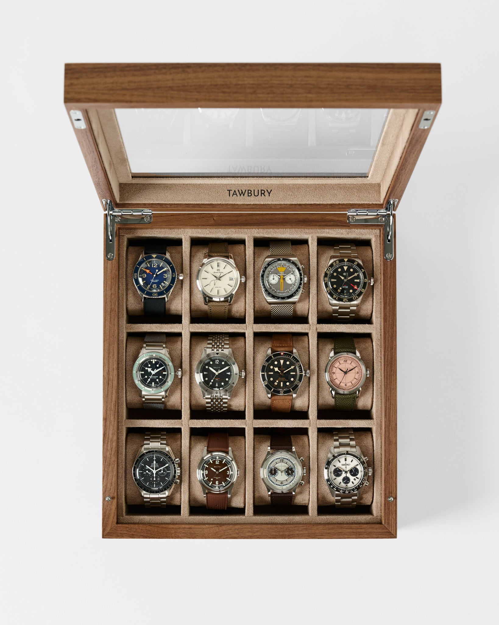 The TAWBURY Grove 12 Slot Wooden Watch Box in light walnut wood features a glass lid, elegantly displaying twelve wristwatches in separate compartments for stylish storage.