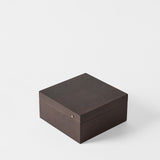 The TAWBURY Grove 6 Slot Wooden Watch Box in dark walnut wood, shown with its lid closed, features a smooth finish and is displayed on a plain white background.