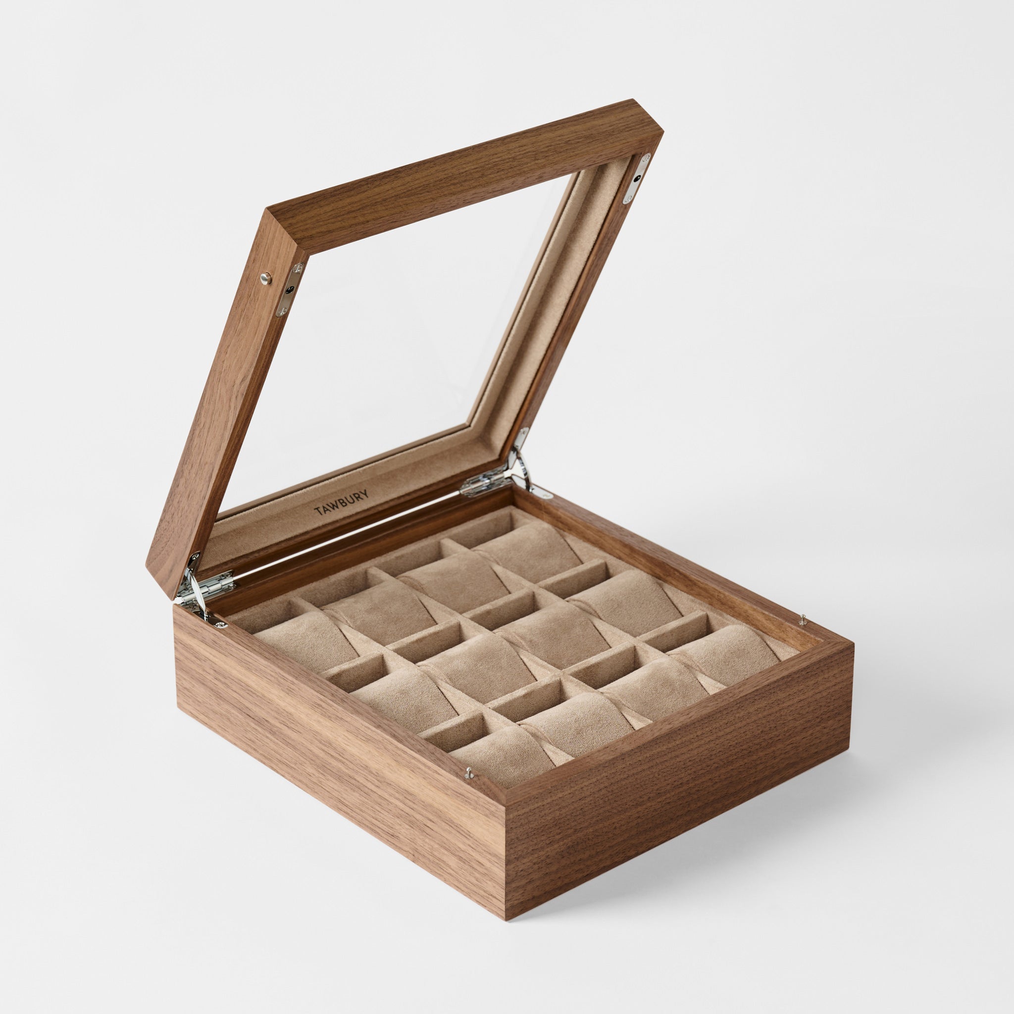 The TAWBURY Grove 12 Slot Wooden Watch Box in classic walnut wood features a glass lid and multiple beige compartments, making it an elegant watch display case for your collection.