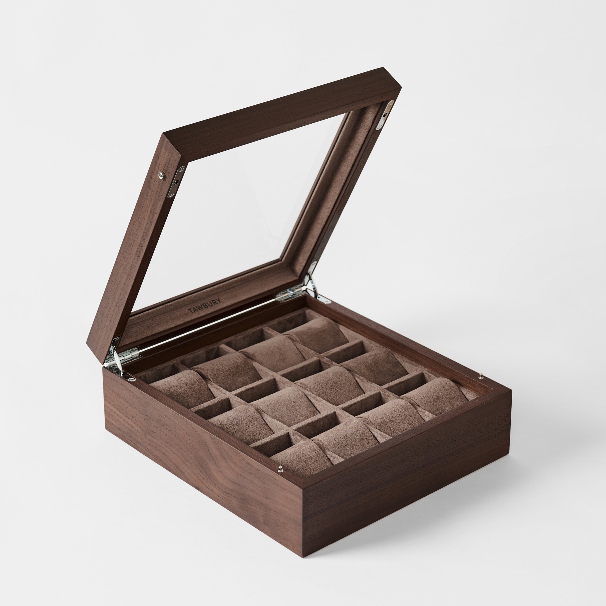 The TAWBURY Grove 12 Slot Wooden Watch Box in Dark Walnut features a glass lid and cushioned compartments for watches or jewelry, displayed open against a white background.