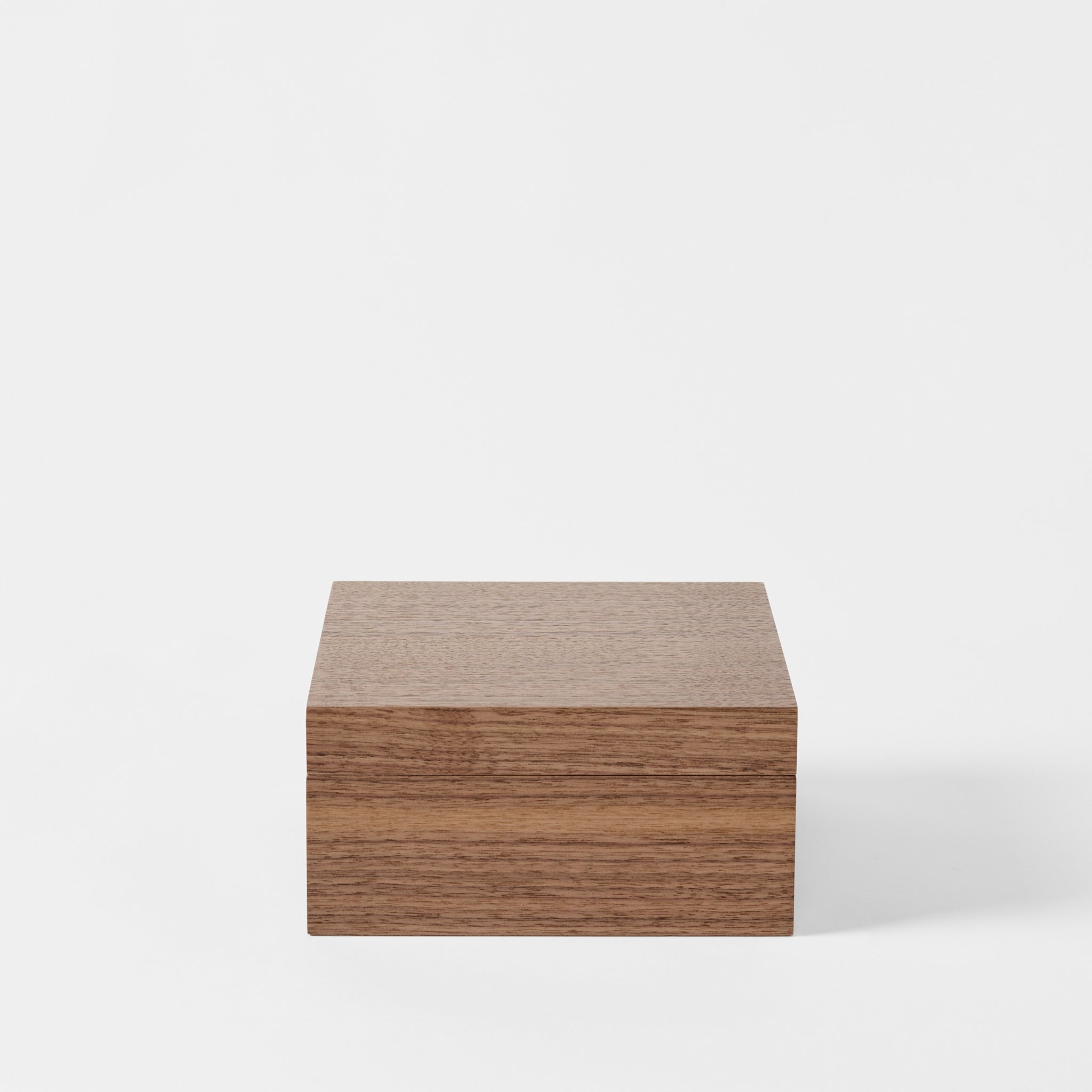 A square, closed TAWBURY Grove 6 Slot Wooden Watch Box in classic walnut wood is centered against a white background—ideal for your collection or as an elegant watch display box.
