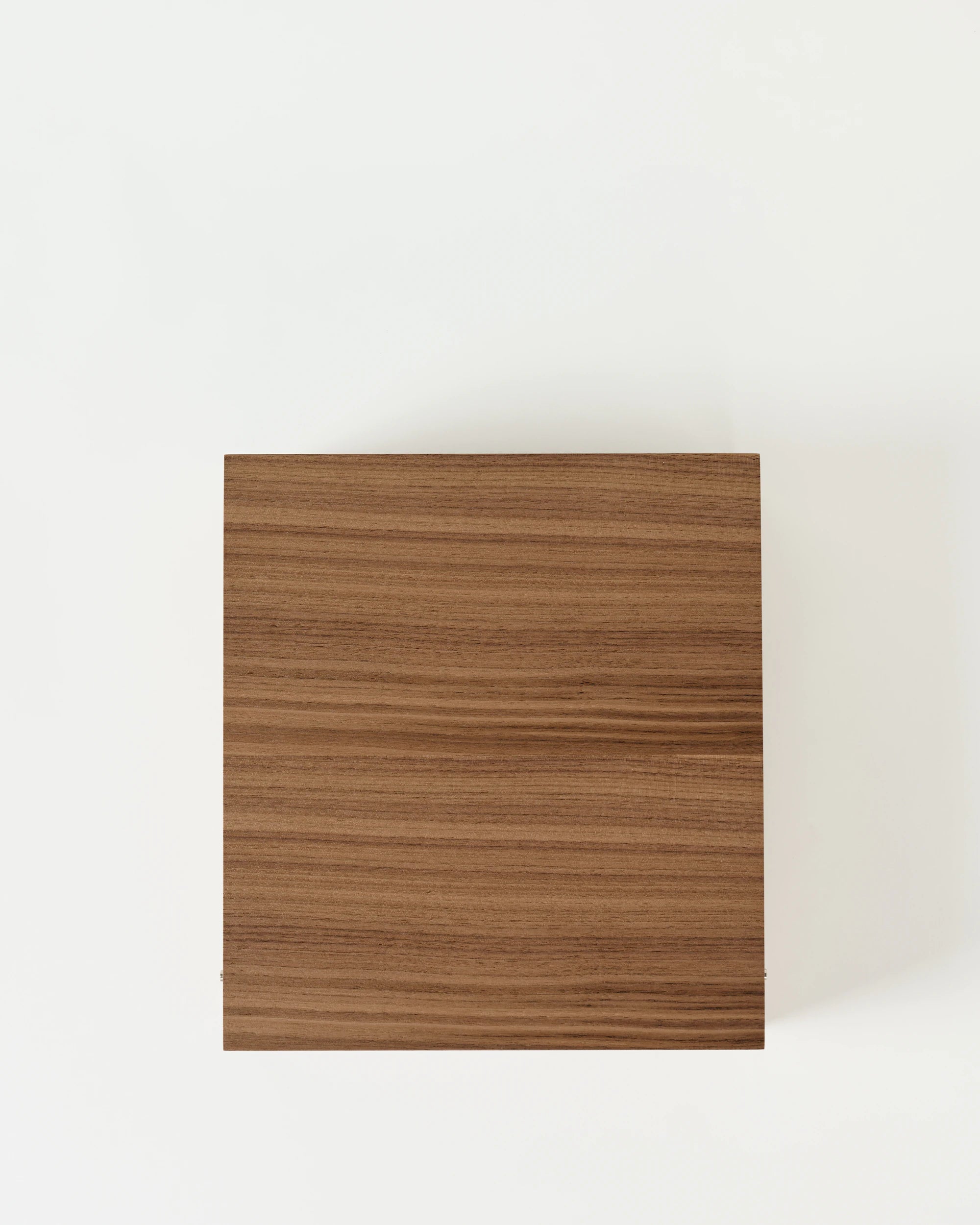 The TAWBURY Grove 12 Slot Wooden Watch Box, crafted in light walnut with a solid lid, is shown from above on a white background—perfect for elegant watch storage.