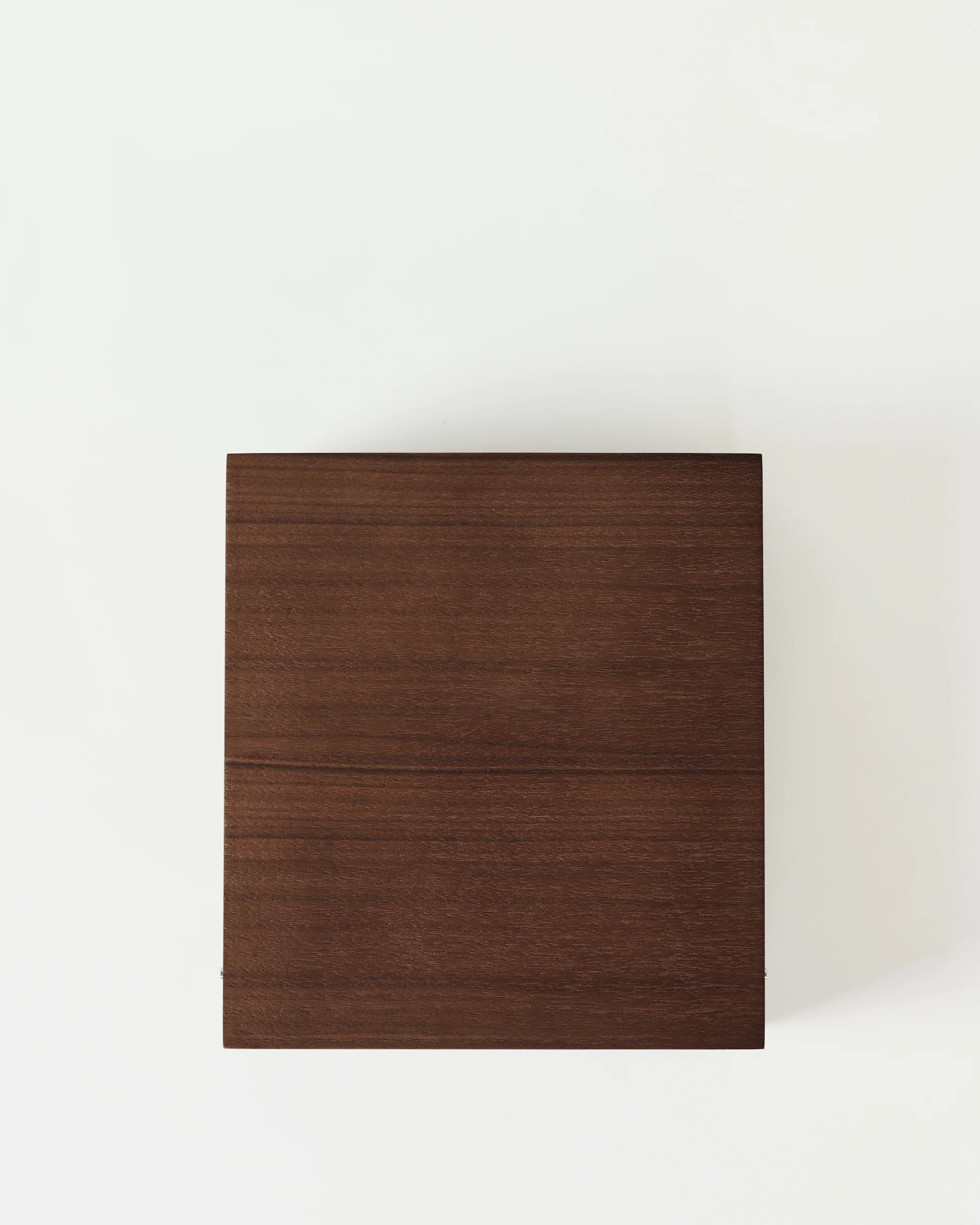 The TAWBURY Grove 12 Slot Wooden Watch Box features a solid lid and dark walnut finish, offering elegant watch storage in a square, closed design—displayed against a plain white background.