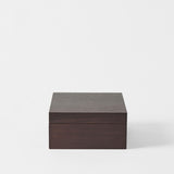 A TAWBURY Grove 6 Slot Wooden Watch Box in dark walnut wood with a closed lid sits on a plain white background, ideal for those who appreciate elegant wooden watch boxes.