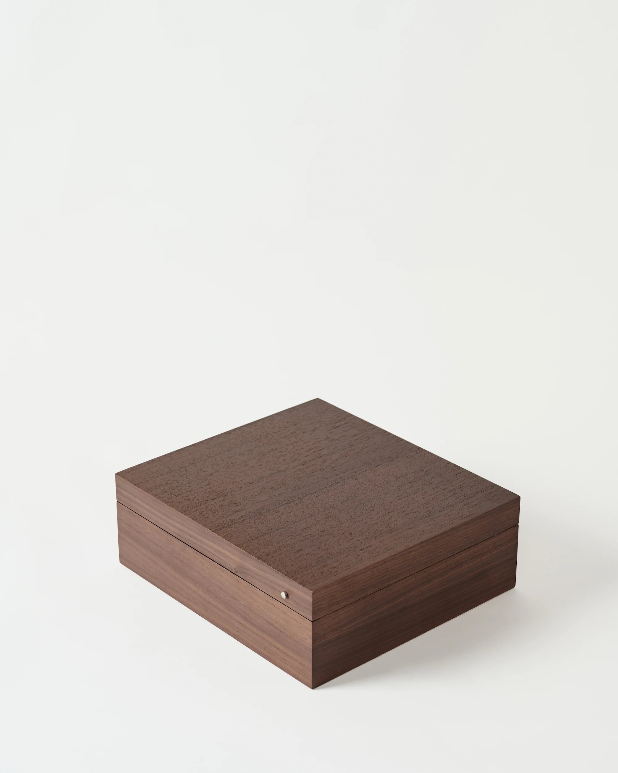 The TAWBURY Grove 12 Slot Wooden Watch Box, crafted from dark walnut wood with a solid lid and smooth finish, is displayed on a plain white background.