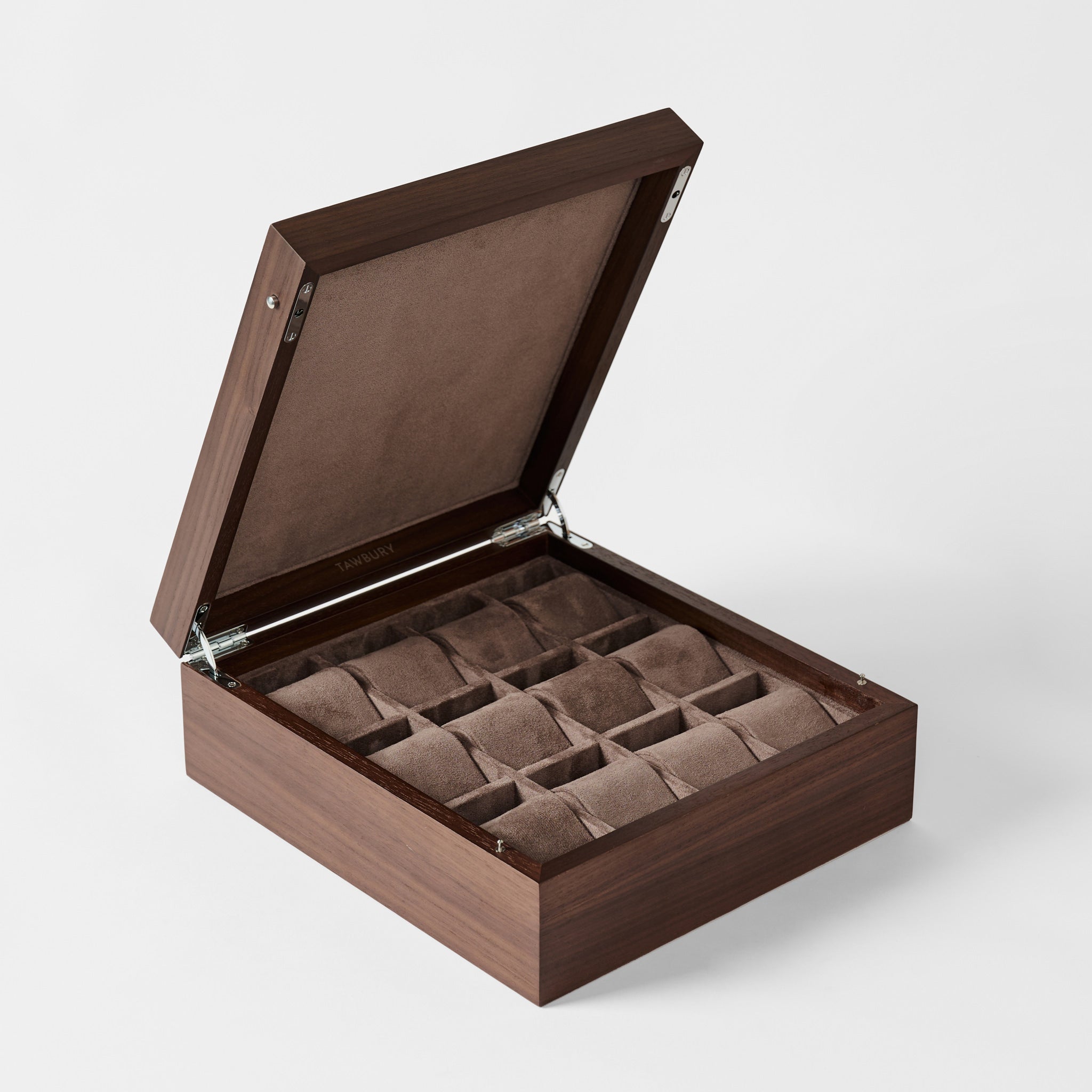 The TAWBURY Grove 12 Slot Wooden Watch Box in dark walnut wood is shown with its lid closed, highlighting its elegant design and spacious storage for watches against a plain background.