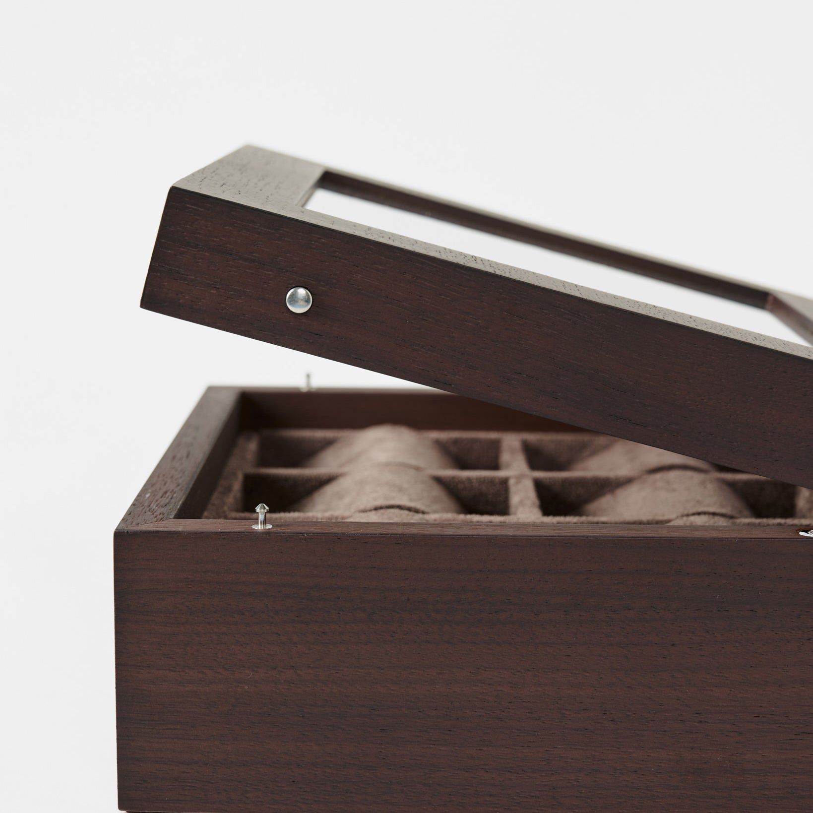 The TAWBURY Grove 6 Slot Wooden Watch Box in dark walnut features a glass lid partially open to reveal divided compartments—ideal for organizing your collection. Photographed against a white background.
