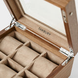 Open Grove 6 Slot Wooden Watch Box by TAWBURY in light walnut wood, with a glass lid and six beige velvet-lined compartments—an elegant choice for watch enthusiasts seeking stylish wooden storage.