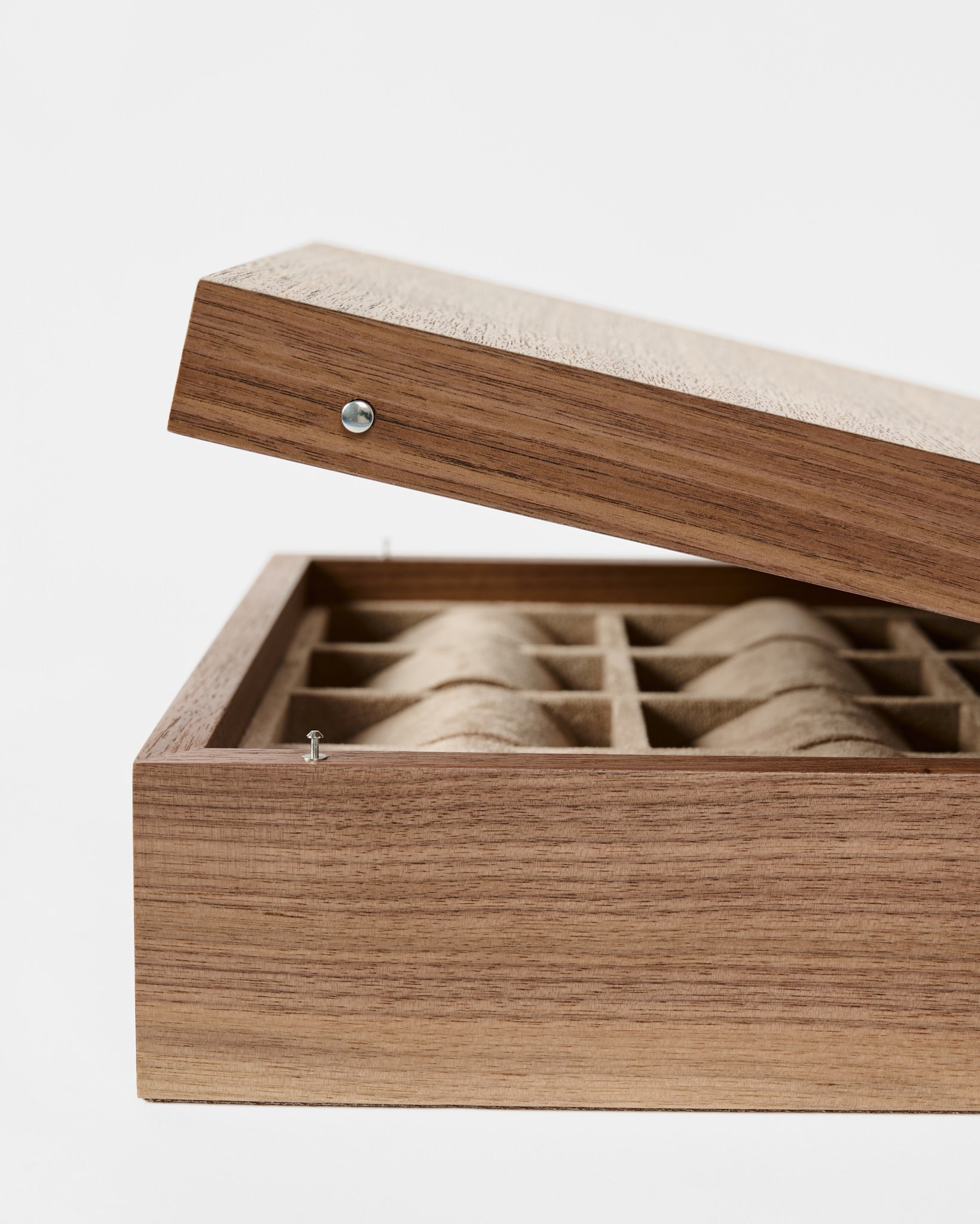 The TAWBURY Grove 12 Slot Wooden Watch Box in Light Walnut features a solid lid and multiple cushioned compartments, making it the ideal organizer for watch collectors.