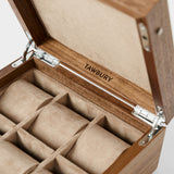 The TAWBURY Grove 6 Slot Wooden Watch Box in light walnut features a solid lid and six cushioned compartments, ideal for stylishly displaying your watch collection.