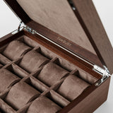 The TAWBURY Grove 12 Slot Wooden Watch Box features a dark walnut solid lid and twelve suede-lined compartments for organized watch storage—an elegant and stylish watch organizer.