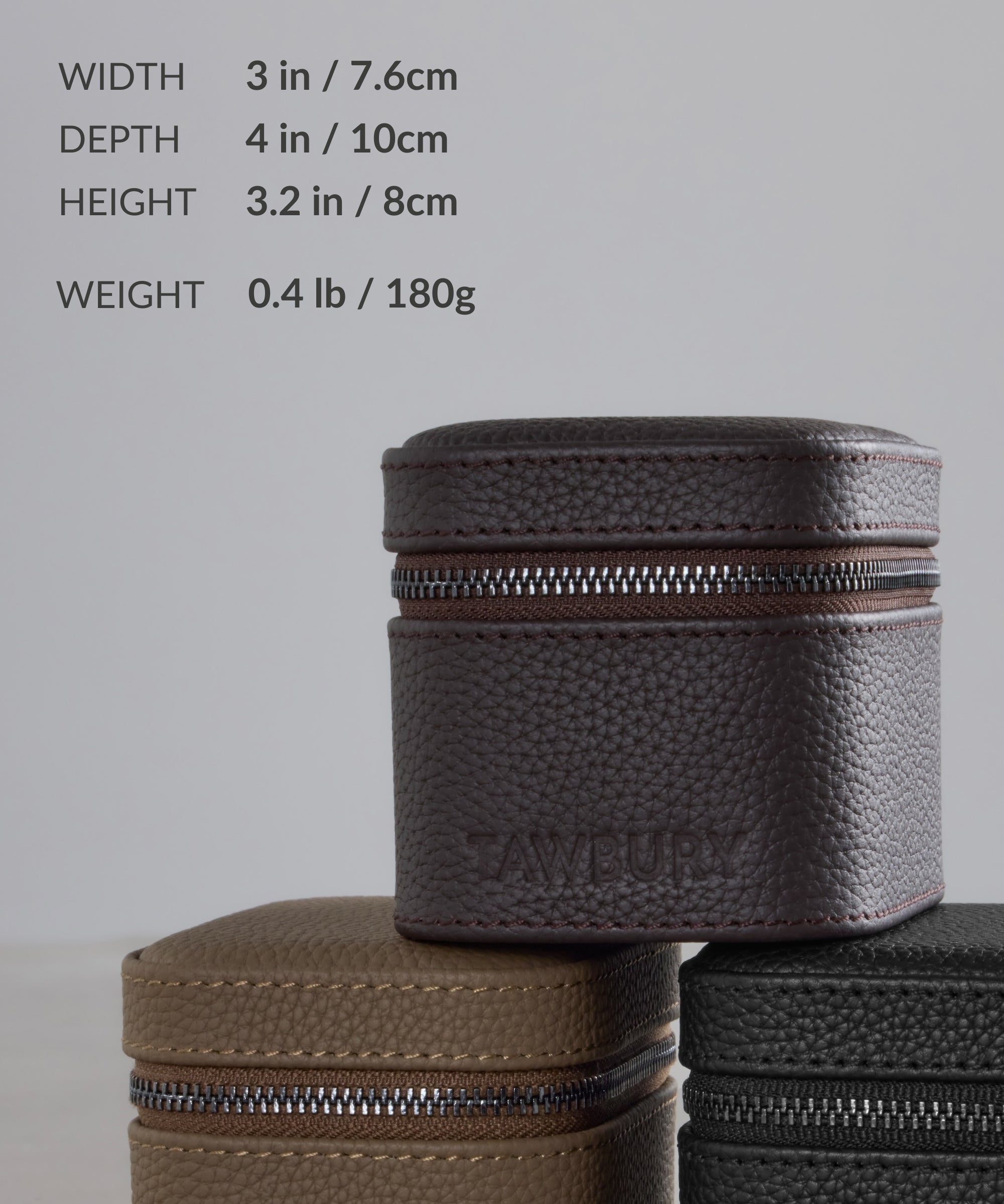 The TAWBURY Fraser 1 Watch Travel Case in Brown (Coming Soon) offers compact, stylish protection for your watch on the go, with size and weight details shown in the background.