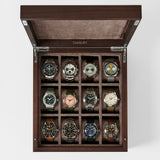 The TAWBURY Grove 12 Slot Wooden Watch Box in dark walnut features twelve compartments and a solid lid, providing elegant storage and display for your wristwatches in three neat rows of four.