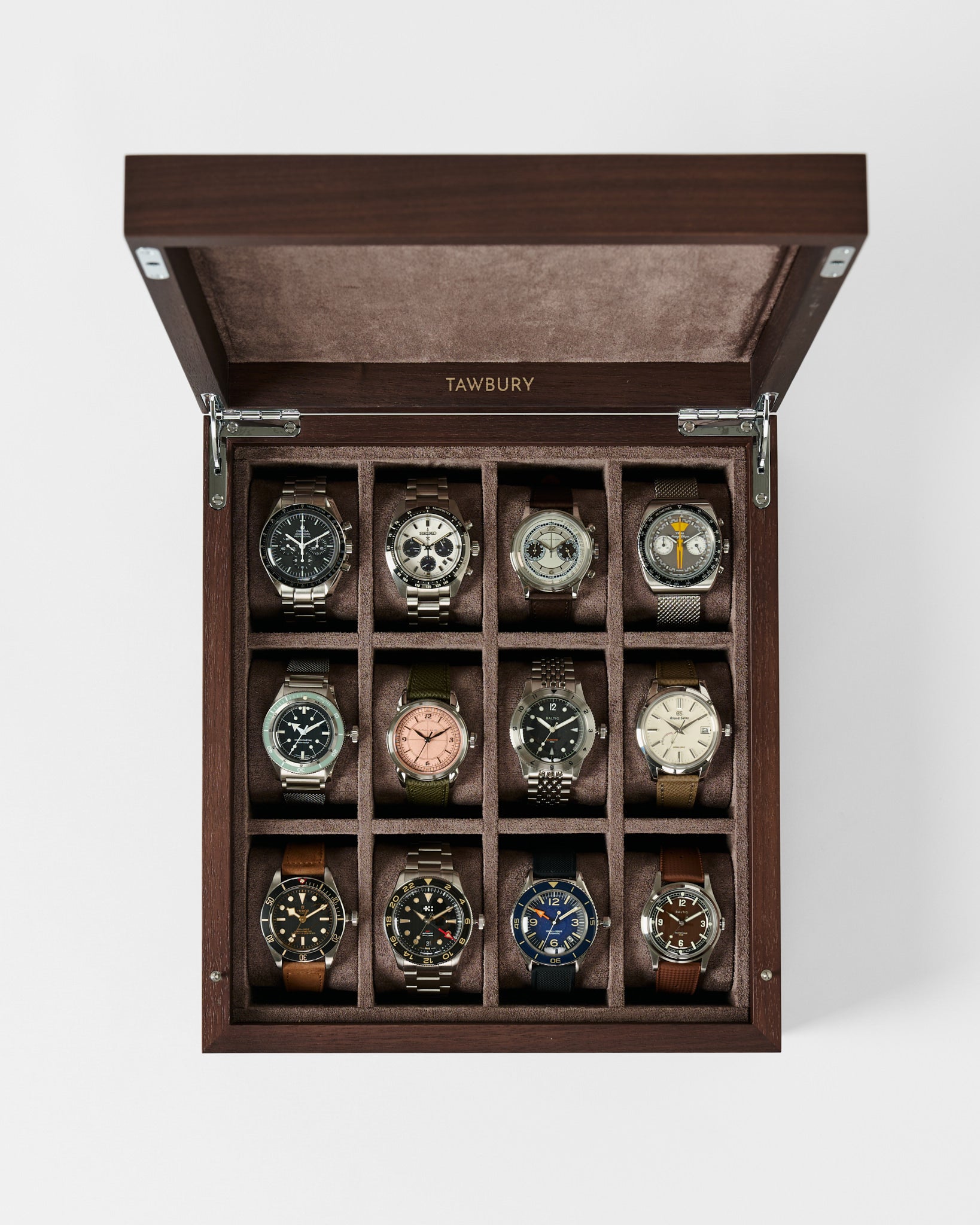 The TAWBURY Grove 12 Slot Wooden Watch Box in dark walnut features twelve compartments and a solid lid, providing elegant storage and display for your wristwatches in three neat rows of four.