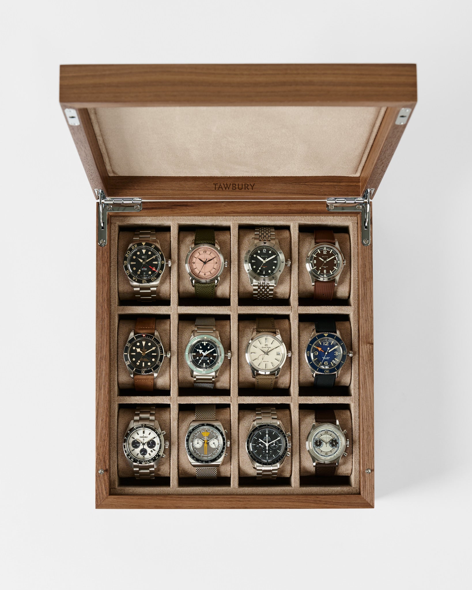 The TAWBURY Grove 12 Slot Wooden Watch Box in light walnut offers elegant storage for twelve watches, each in its own compartment, and features a solid lid for secure and stylish organization.