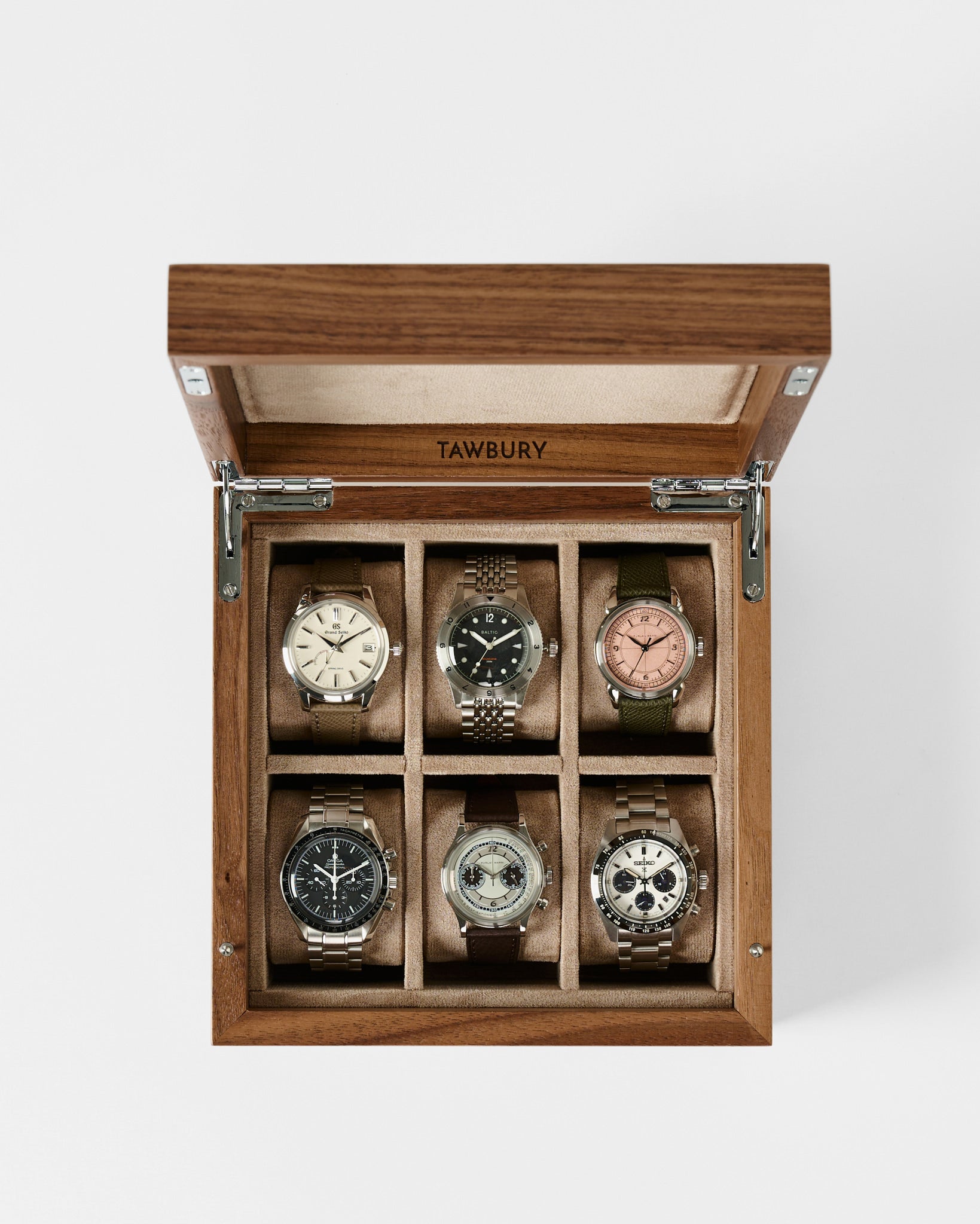 The TAWBURY Grove 6 Slot Wooden Watch Box in Light Walnut Wood with a solid lid elegantly displays six wristwatches, each in its own compartment—ideal as a refined storage case for your watch collection.